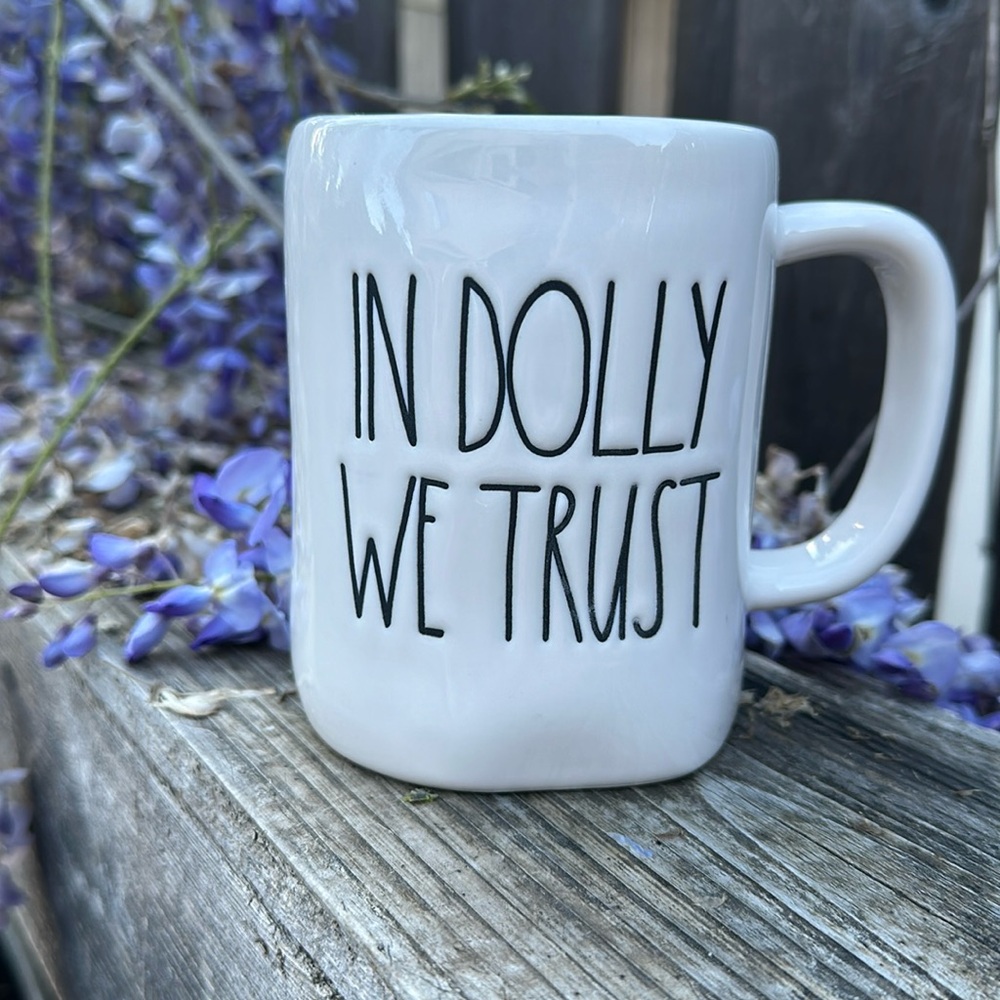 Rae Dunn Mug In Dolly We Trust with maroon color inside. In great condition